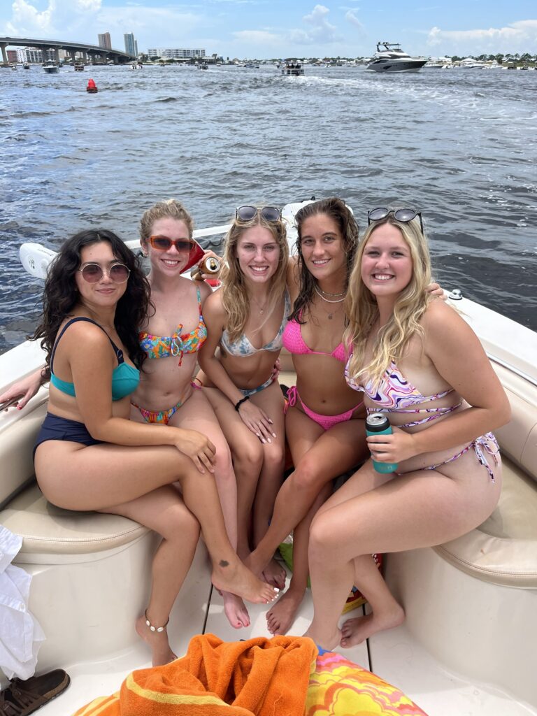 Private boat cruising through Orange Beach Alabama with calm water and coastal views