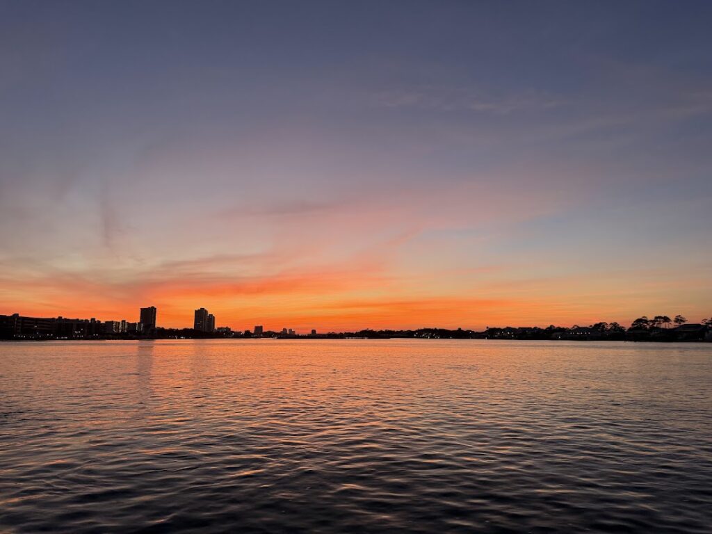 Sunset over the water during a private sunset cruise in Orange Beach Alabama